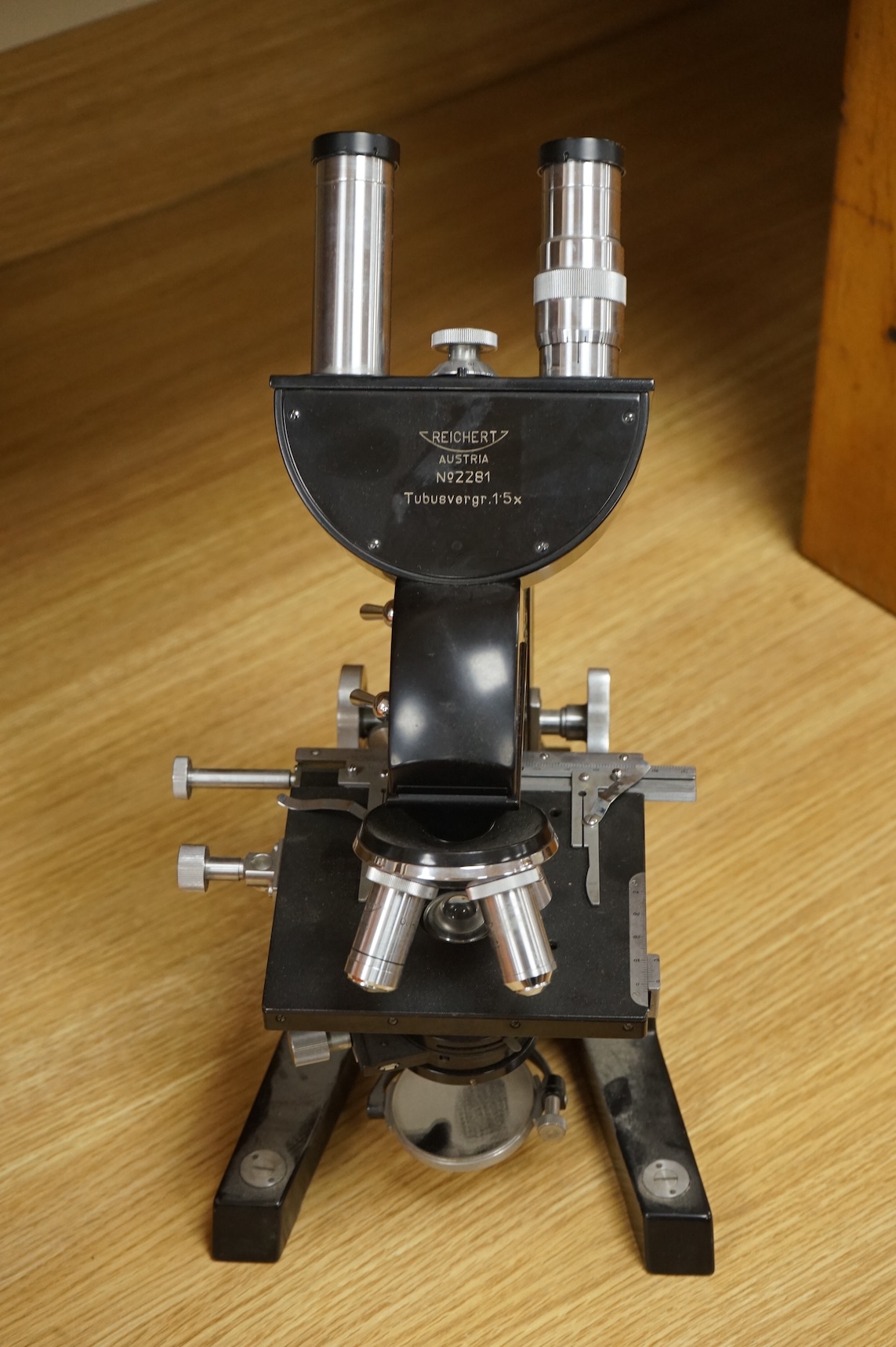A mid 20th century Reichert, Austria binocular microscope, 34cm high.